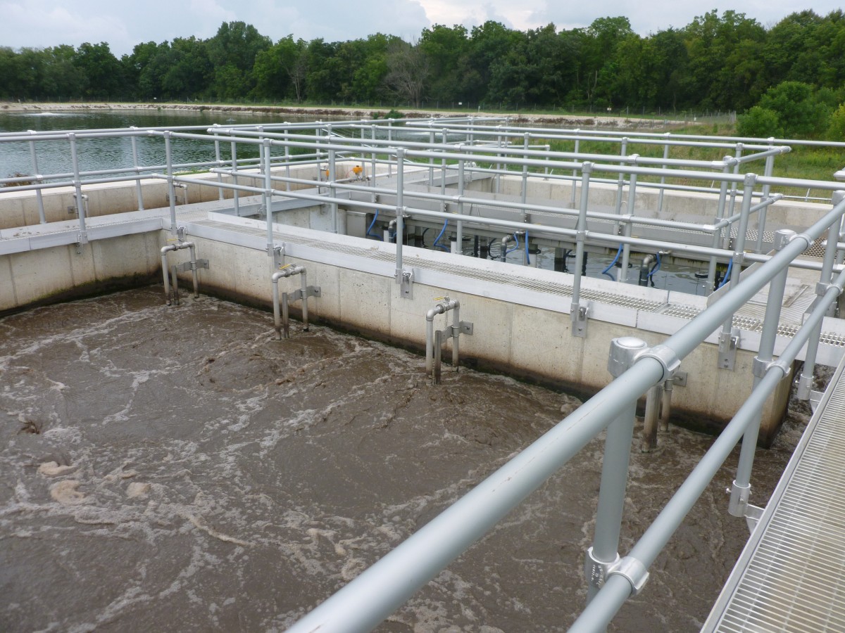This wastewater treatment plant in Fairbank, Iowa, shows diffused aeration in the foreground (in the tank) and mechanical aerators in the background (in the lagoon).